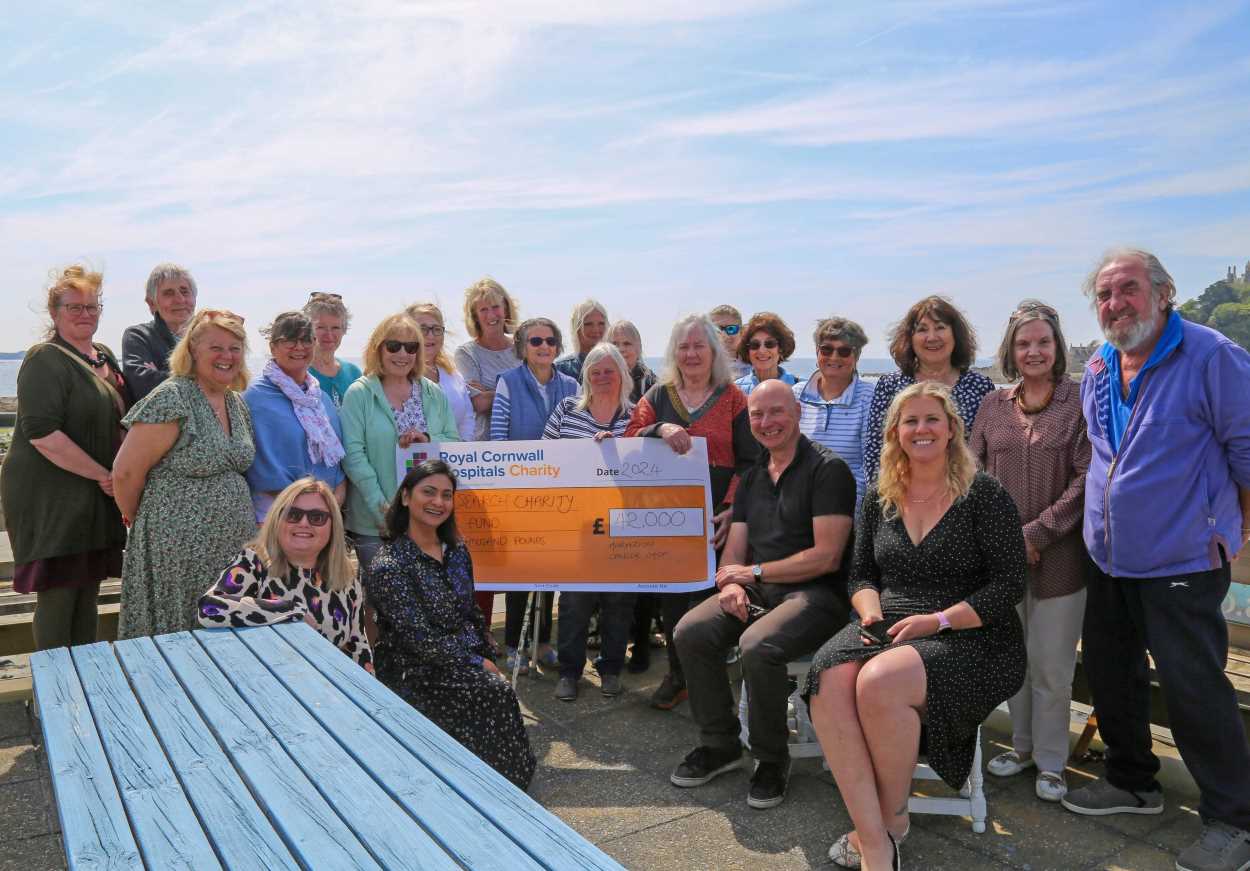 Marazion Cancer Shop volunteers and RCHT Research and Development staff gathered for a cheque presentation