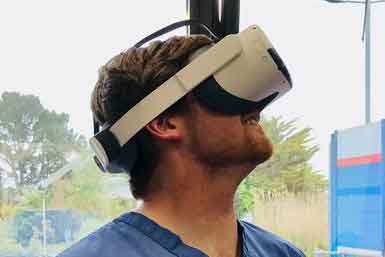 Doctor Niall Moon wearing a virtual reality headset.